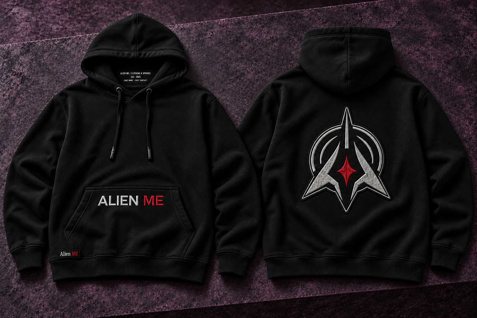 Black AM Emblem Hoodie, front and back, with white-and-red ALIEN ME pocket embroidery and a lowered embroidered back patch
